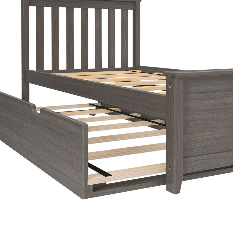 Gray wood platform bed frame with vertical slatted headboard, exposed wooden slats and pull-out trundle on casters, modern farmhouse style