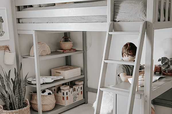 Grey loft bed with desk and bookcase