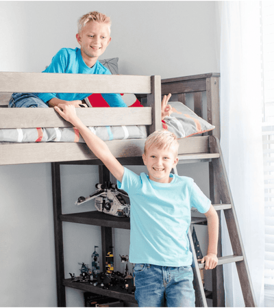 Solid wood high loft bed with shelf storage in shared boys room