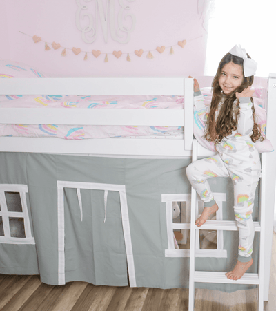 Twin low loft bed with grey underbed play curtain in girls room