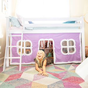 Low loft bed with purple underbed play curtain in colorful girls room
