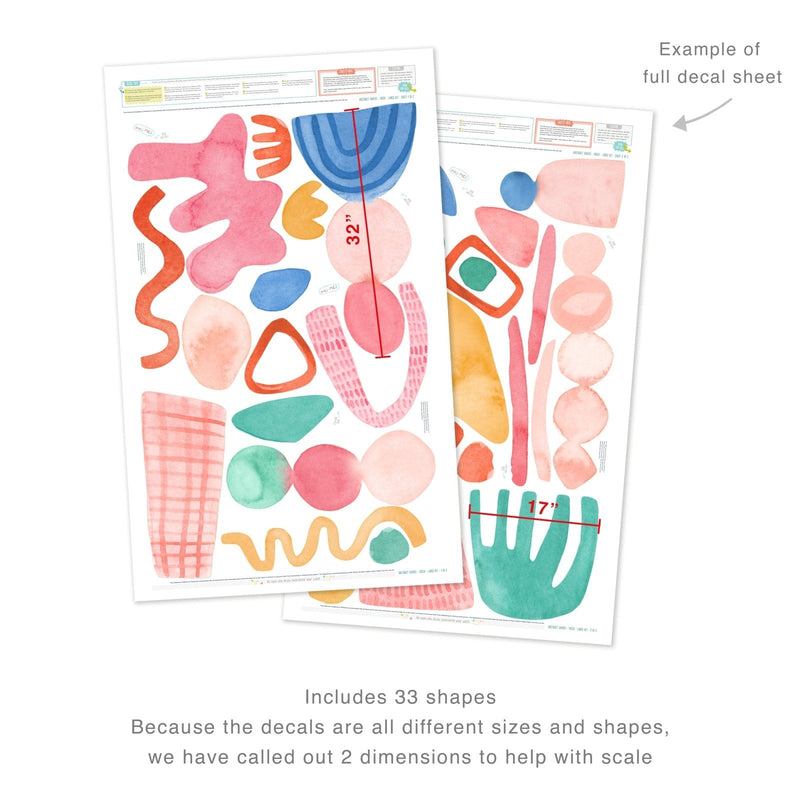 Abstract watercolor wall decals sheet with 33 pastel shapes in pink, blue, green and orange — large removable vinyl wall stickers (32" and 17" scale shown) for nursery, kids room and modern living room decor