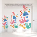 Colorful watercolor abstract wall decals on white wall showing small, medium and large kit size comparison next to door — removable nursery and kids room decor stickers