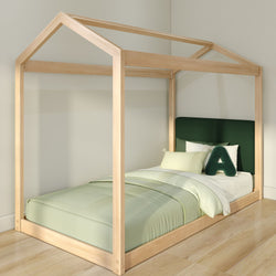 Kids house-frame wooden canopy bed with green upholstered headboard, sage bedding and decorative "A" pillow in a minimalist children's bedroom