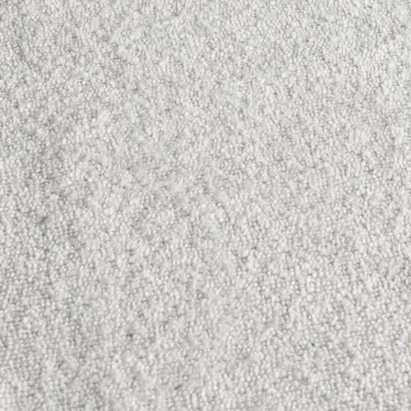 Close-up of soft white plush loop-pile carpet texture for home flooring and interior design