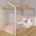 Wooden house-frame kids bed with pink upholstered headboard, pink plaid bedding and plush "A" pillow in modern children's bedroom