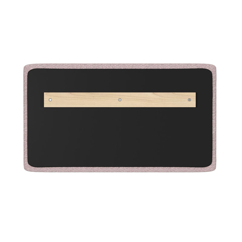 Pink fabric‑framed wall bulletin board with black felt surface and centered wooden mounting strip secured by screws