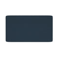 Navy blue rectangular bath mat with rounded corners and textured surface on white background