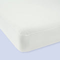 White corner mattress showcasing clean and smooth surface, ideal for modern bedroom comfort and aesthetics.
