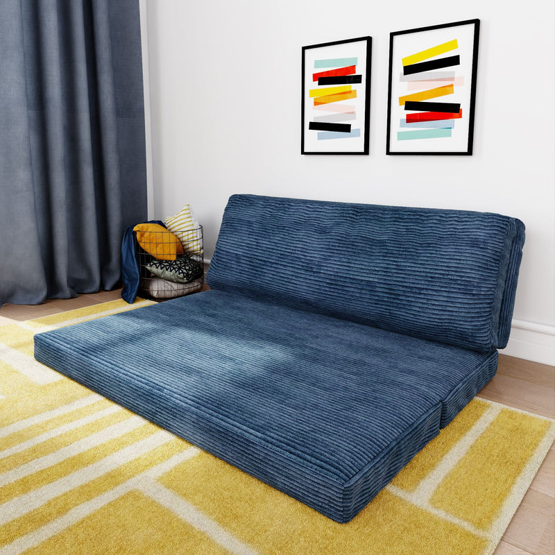 Blue foldable corduroy futon sofa on a yellow rug in modern living room setting.