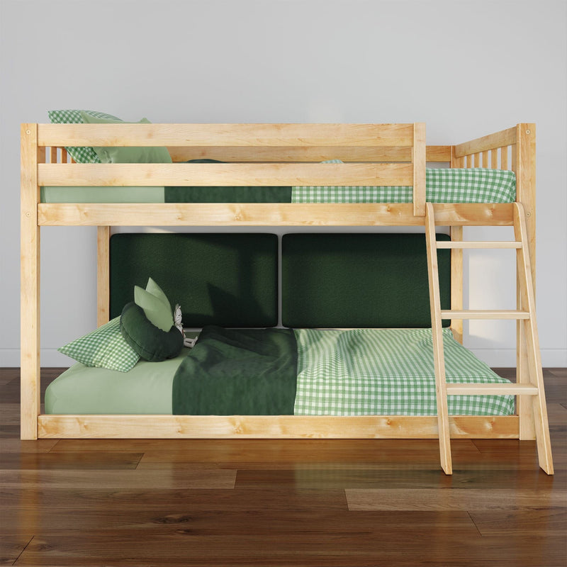 Natural pine wooden bunk bed with right-side ladder, green gingham and solid green bedding, plush pillows and dark green headboard panels on hardwood floor in a modern kids' bedroom
