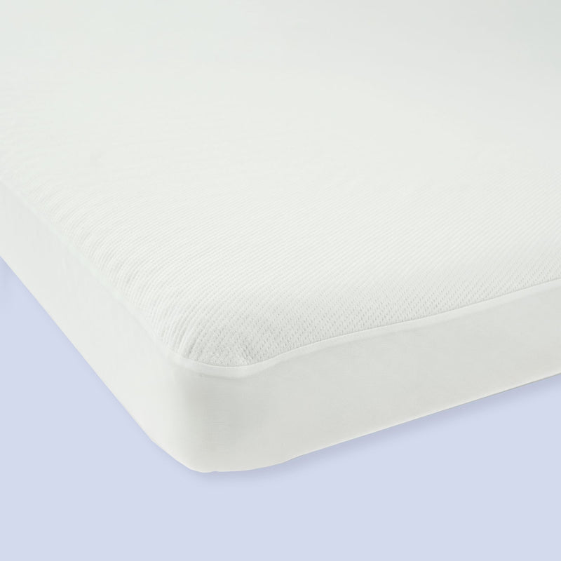 White breathable mattress with seamless corners on a light blue background.