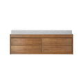 Mid-century modern walnut dresser with multiple storage drawers topped by a white changing pad on a white background