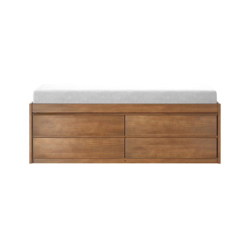 Mid-century modern walnut dresser with multiple storage drawers topped by a white changing pad on a white background