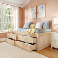 Natural wood storage bed with multiple under-bed drawers, pastel blue and yellow bedding and striped pillows, blue butterfly wall art and sheer curtains in a sunlit cozy bedroom