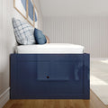 Navy blue storage twin bed with built-in underbed cabinets, white shiplap walls, blue plaid and denim pillows on hardwood floor