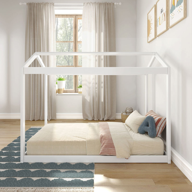 Children's bedroom with white Montessori-style floor bed, cozy striped bedding, and natural light streaming through a window with curtains.