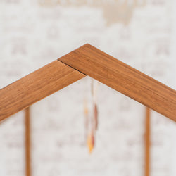 Close-up of a wooden roof joint with a blurred background.