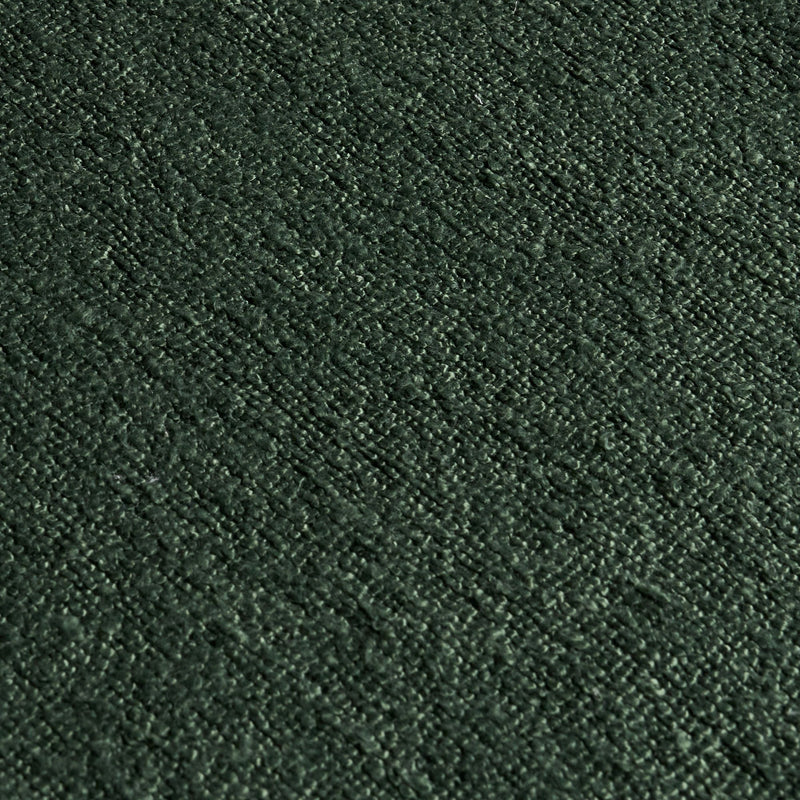 Close-up of dark green boucle upholstery fabric texture, looped woven carpet material ideal for sofas, rugs, and home decor