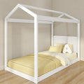 White wooden house-frame canopy single bed with yellow bedding and plush "A" pillow on hardwood floor in modern kids' bedroom
