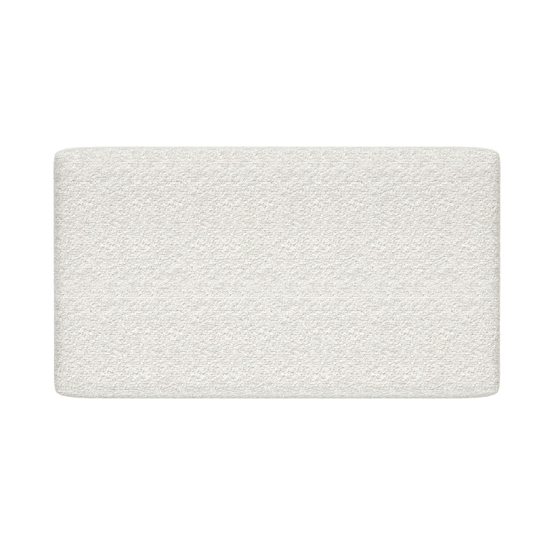 White textured mattress topper with rounded corners, quilted foam mattress pad product photo on white background