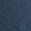 Close-up of navy blue loop-pile carpet texture, durable commercial flooring fabric with tight looped fibers
