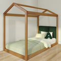 Wooden house-shaped twin bed frame with green upholstered headboard, pastel green bedding and natural wood flooring in a modern minimalist children's bedroom