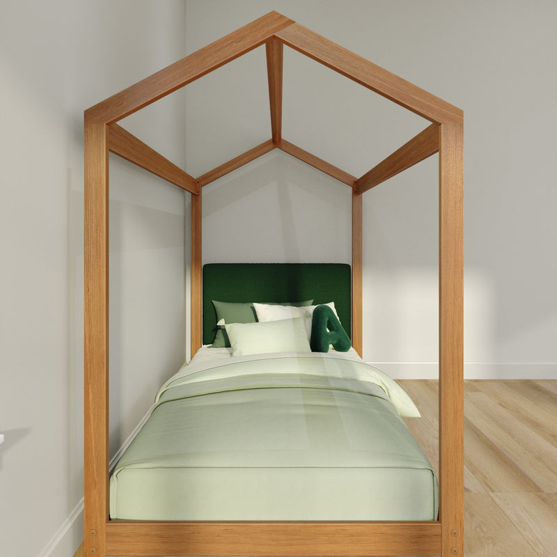 Minimalist house-shaped wooden canopy kids bed with green upholstered headboard and light green bedding in modern bedroom