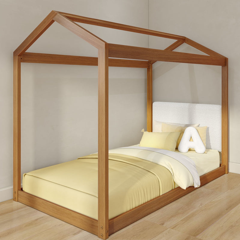 Wooden house-frame canopy kids bed with yellow bedding and plush letter A pillow in modern nursery