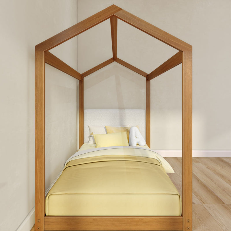 Minimalist wooden house-frame canopy kids bed with yellow duvet and accent pillows in a light, modern children's bedroom with hardwood floor