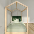 Wooden house-frame single bed with green bedding and pillows in a minimalist modern kids' bedroom