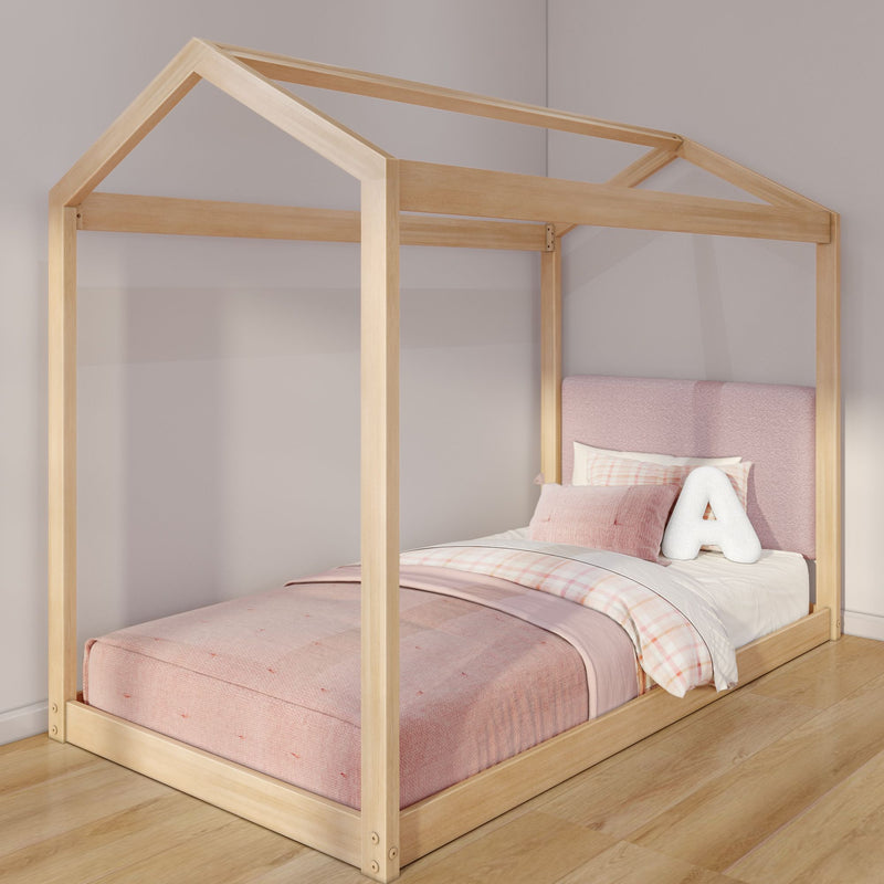 Wooden house-frame kids/toddler bed with pink mattress, plaid duvet, upholstered headboard and plush letter A pillow in a modern girls' bedroom