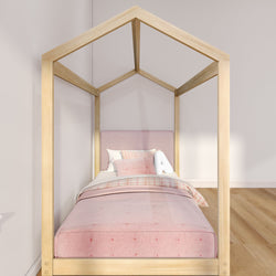 Modern wooden house-frame children's single bed with pink upholstered headboard, plaid bedding and decorative pillows in a minimalist nursery