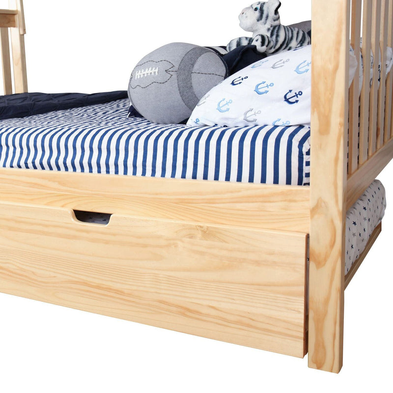Natural pine children's bed with under-bed storage trundle drawer, navy blue striped fitted sheet, nautical anchor pillow, gray football cushion and plush tiger toy