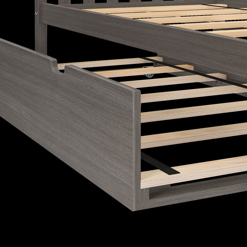 Grey wood platform bed frame with wooden slats and under-bed pull-out trundle drawer on caster wheels for storage, modern bedroom furniture