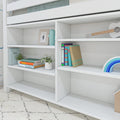 White kids bookshelf and nursery shelves with colorful children's books, potted plants, wooden toy guitar and rainbow toy — modern kids' bedroom storage and decor