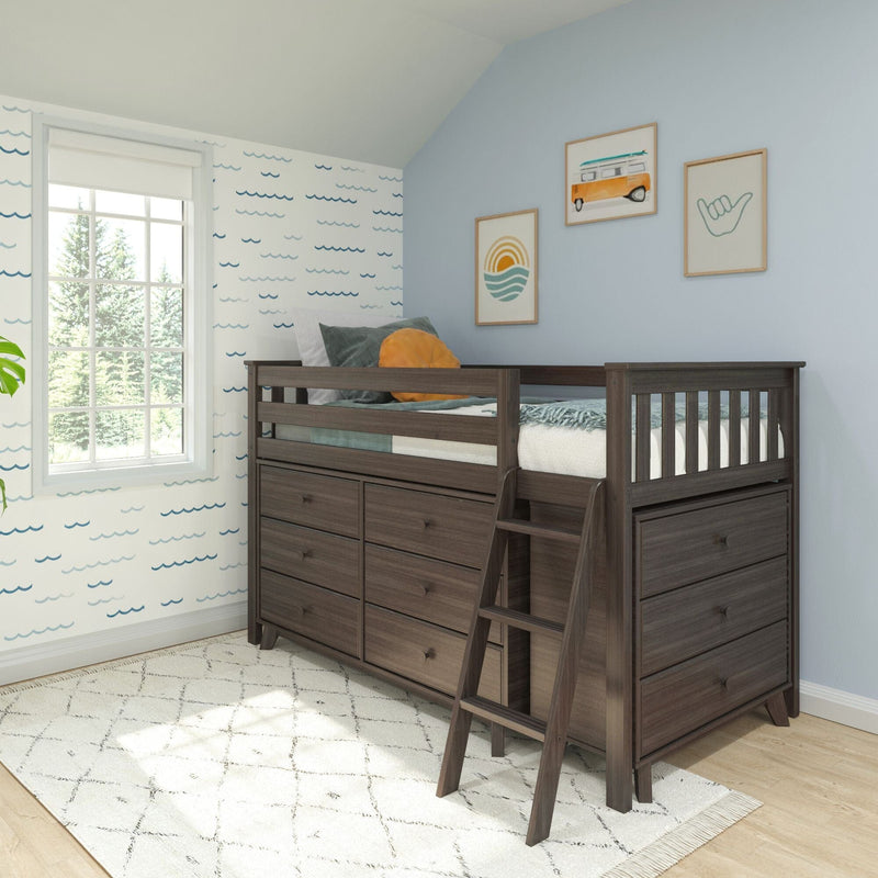 Dark walnut loft bed with built-in storage drawers and ladder in a coastal-themed kids' bedroom, blue wave wallpaper, framed surf art, white patterned rug and large window