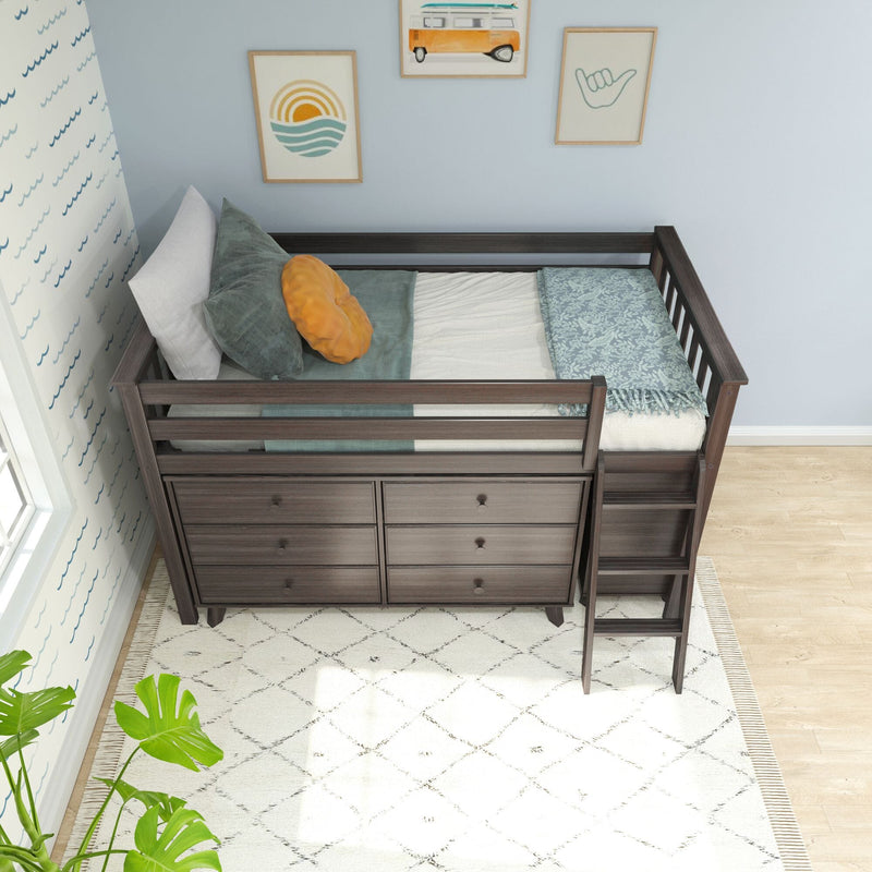 Dark wooden loft bed with integrated dresser drawers and ladder, featuring cozy bedding and decorative wall art, in a light-filled children's bedroom.