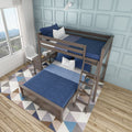 Modern wooden twin-over-full bunk bed with navy blue bedding, light-blue paneled accent wall, geometric rug and sunlit window in a kids' bedroom