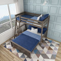 Wooden twin-over-full bunk bed with navy blue bedding and ladder in kids' bedroom, geometric rug and city skyline window view