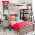 Modern wooden loft bunk bed with ladder, colorful striped bedding and plush pillows, built-in shelves with toys in a kids' bedroom
