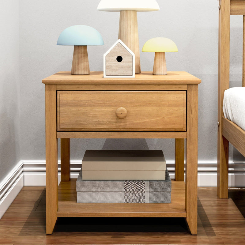 Modern oak bedside table with single drawer, pastel mushroom lamps and wooden birdhouse on top, woven storage boxes on lower shelf in a minimalist bedroom