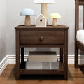 Dark wood bedside table (nightstand) with single drawer, decorative birdhouse, three pastel mushroom table lamps and storage boxes on lower shelf in a bedroom