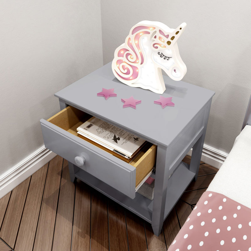 Gray bedside table with an open drawer, featuring unicorn decor and star ornaments, in a modern children's bedroom setting.