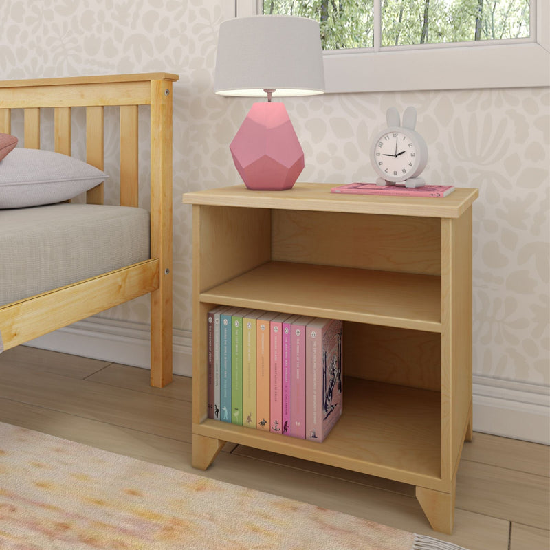 Children's bedroom nightstand with pink geometric table lamp, bunny alarm clock, wooden bed frame and pastel children's books