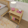 Wooden nightstand with pink lamp and books in a cozy bedroom setting.