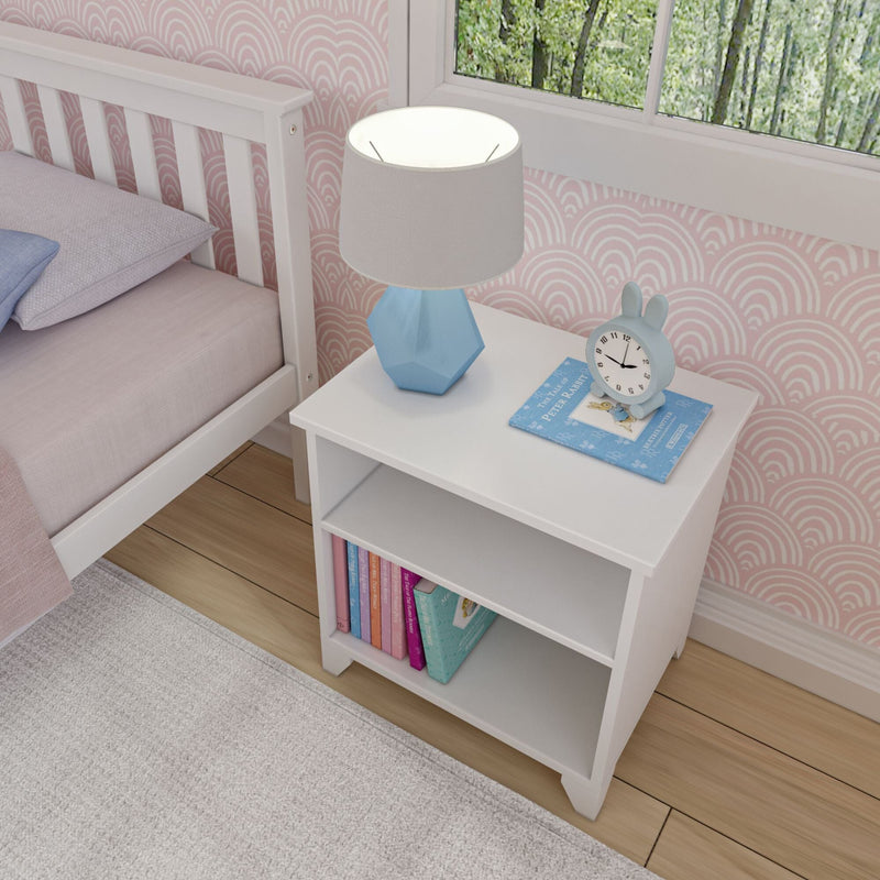 Modern white bedside table with lamp and clock, perfect for a stylish bedroom.