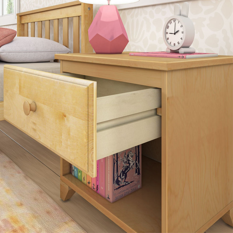 Wooden nightstand with open drawer, books, lamp, and clock in cozy bedroom setting.