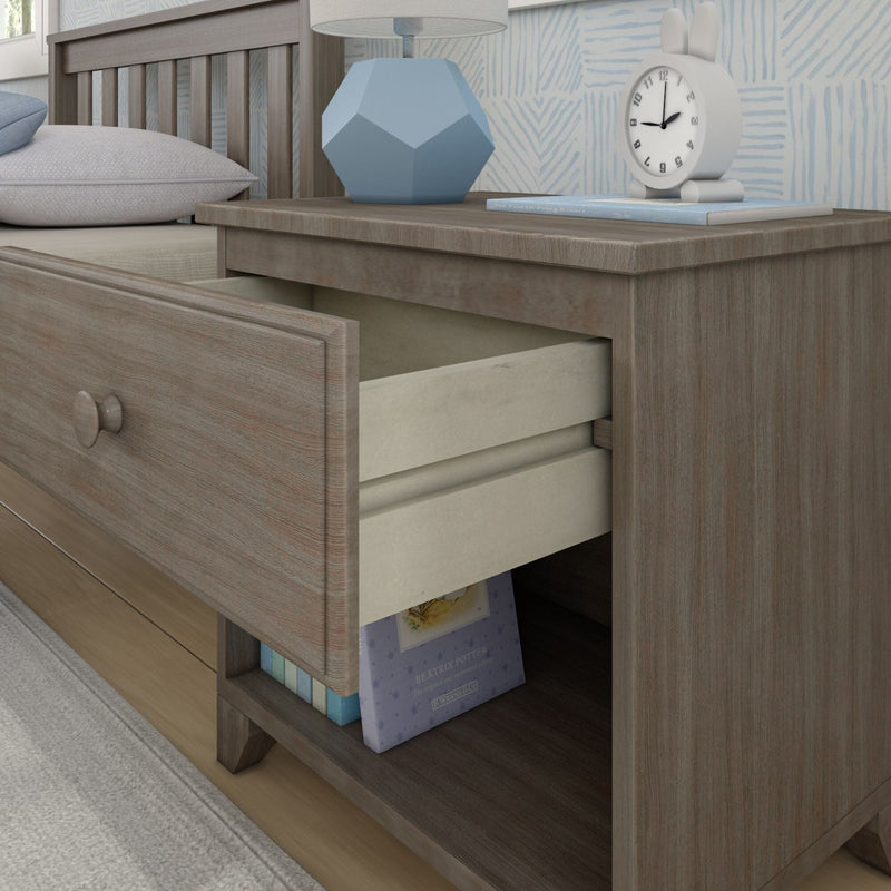 Wooden bedside table with open drawer, blue geometric lamp, and decorative clock in modern bedroom setting.