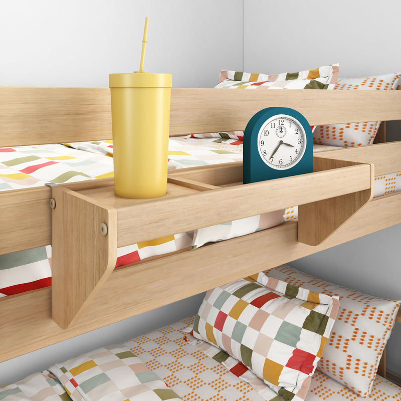 Wooden bunk bed shelf with yellow cup and blue alarm clock, colorful bedding background.